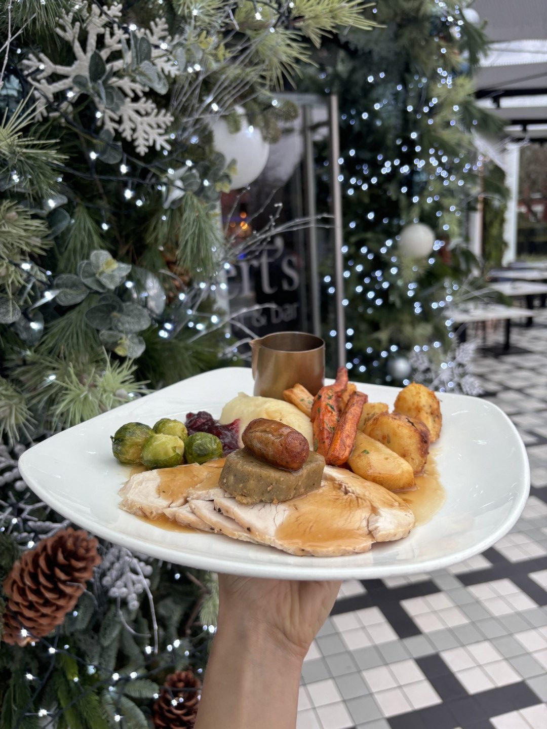 Christmas dinner served beside the decorated Christmas tree at Albert's Shed